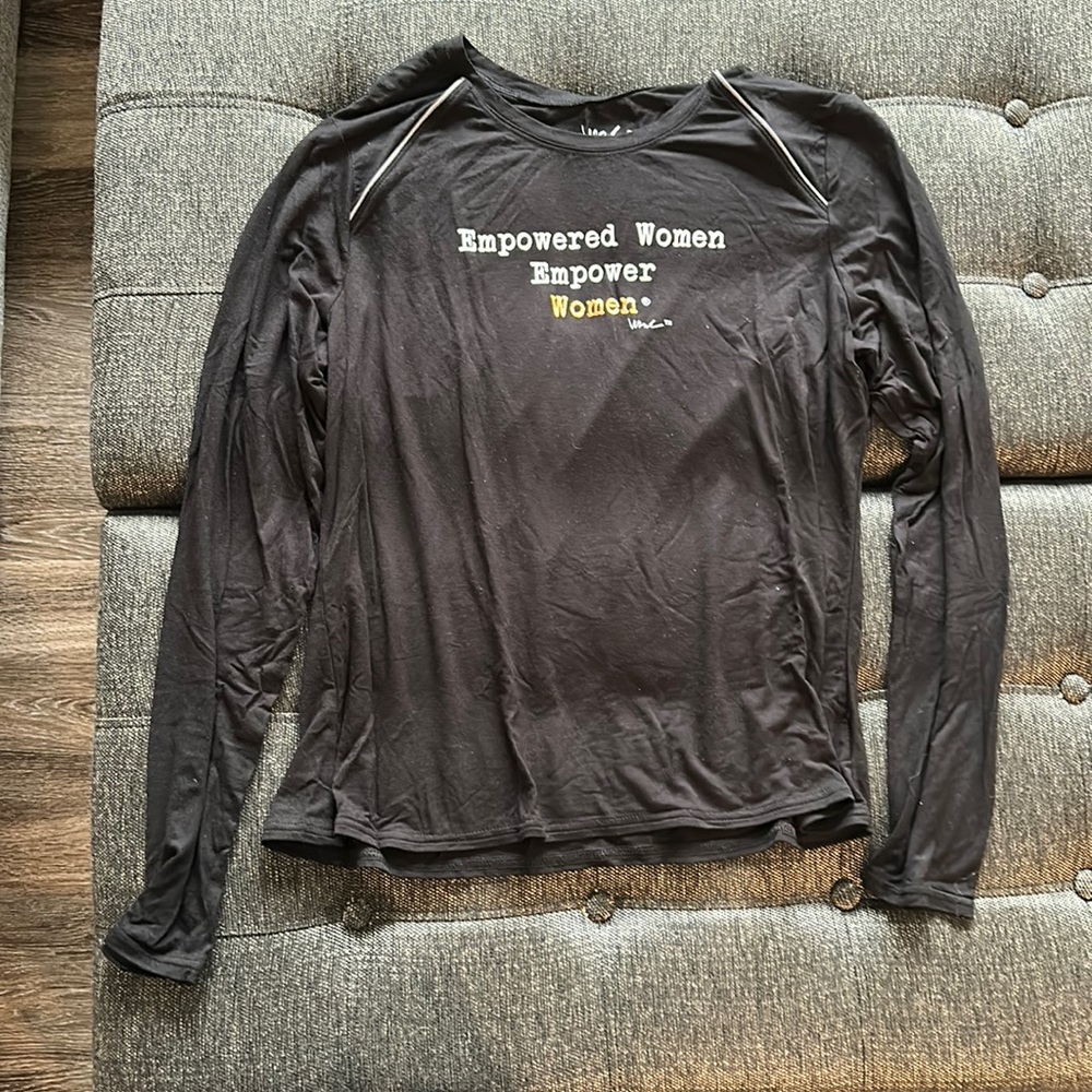 Women’s long sleeve Tee. “Empowered women empower women” color black. Size LG